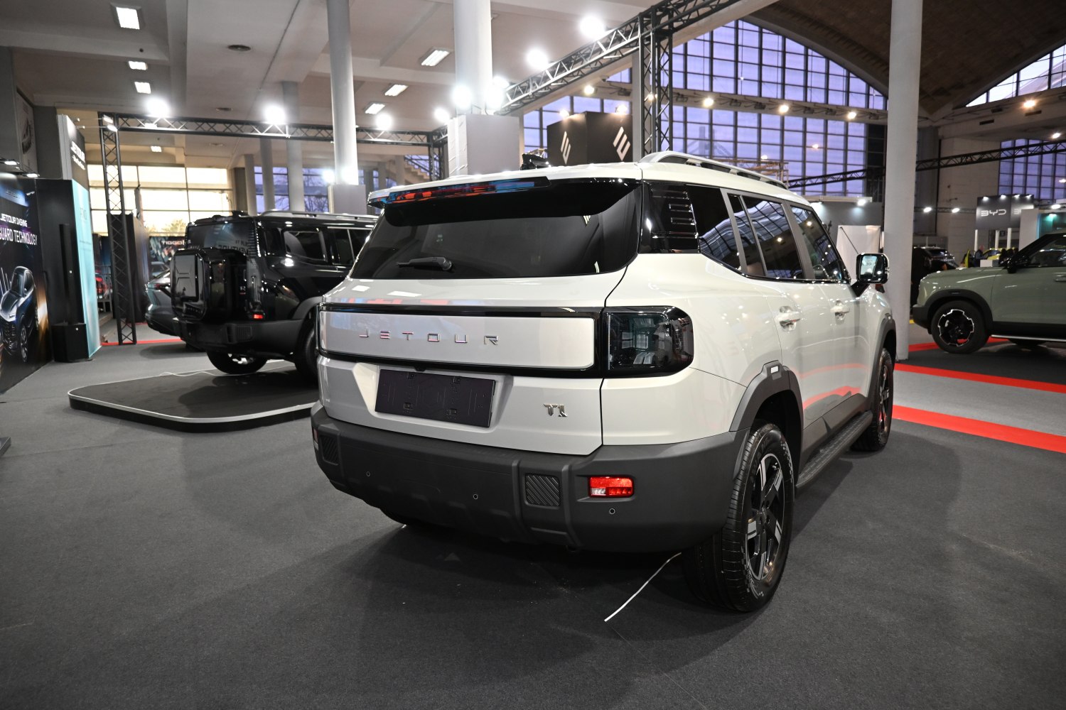 White SUV rear view with distinctive tail lights and robust bumper