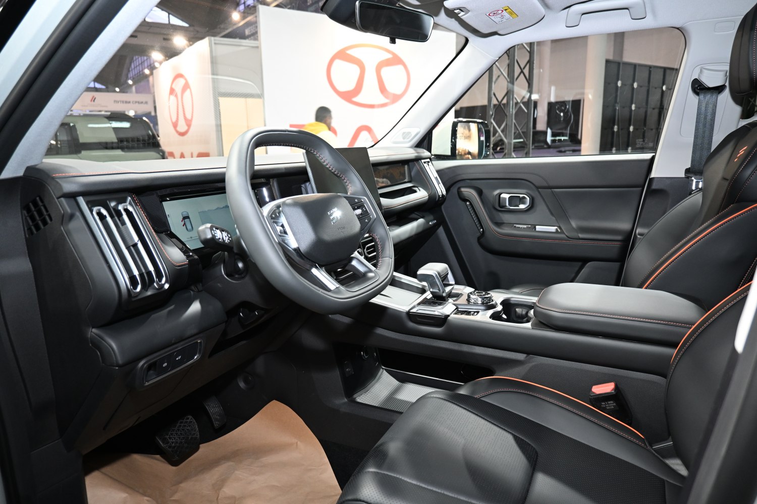 Modern dashboard and steering wheel with digital displays and ergonomic controls