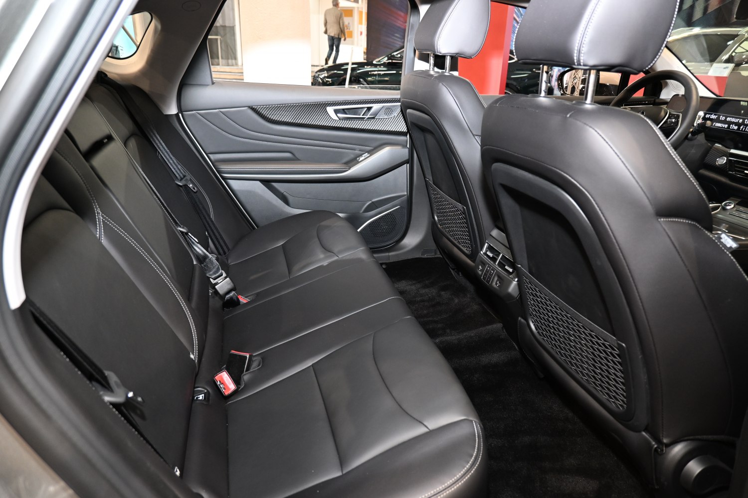 Rear black leather seats with door panel and seat belts