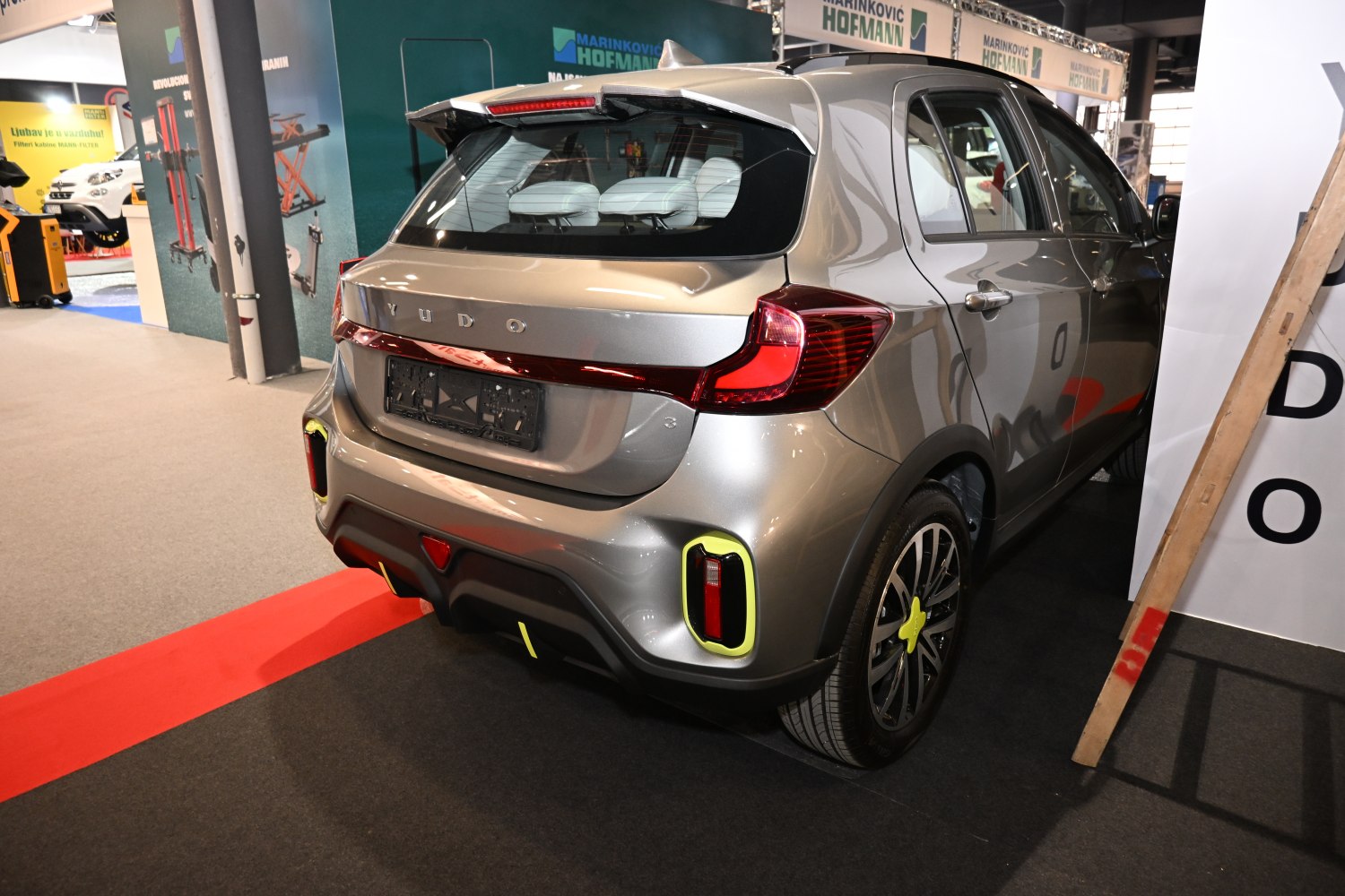 Rear view with distinct tail lights and hatchback design