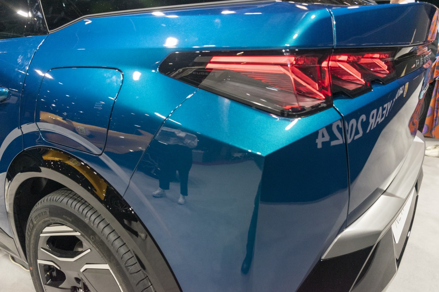 Sleek rear quarter with angular LED tail light and rear wheel details