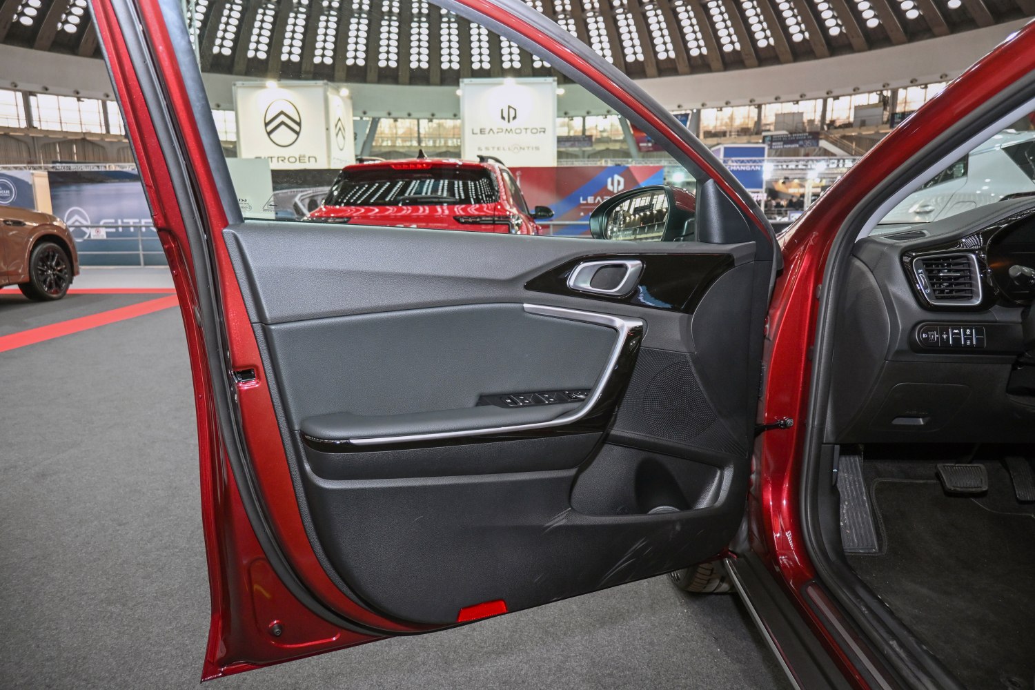 Car door interior panel with ergonomic controls and modern design