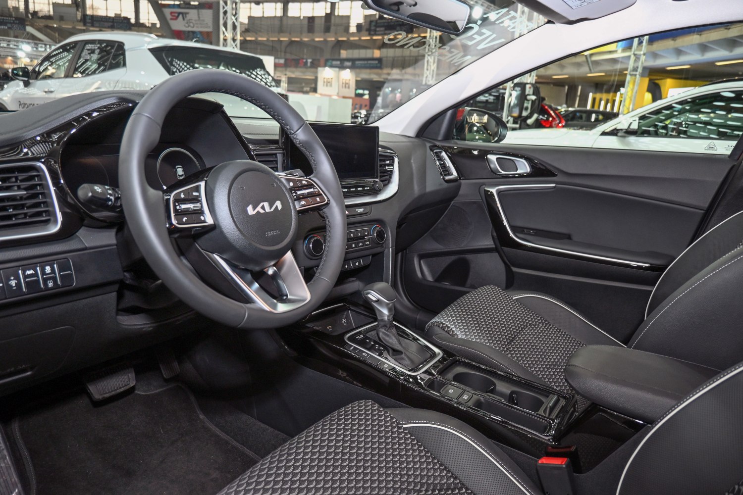 Digital dashboard and touchscreen center console with gear shifter and steering wheel controls