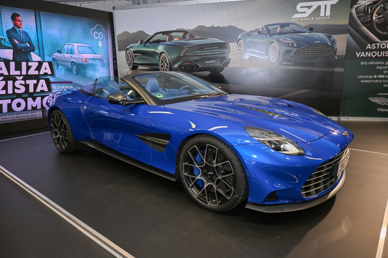 Blue luxury convertible sports car showing front-side profile