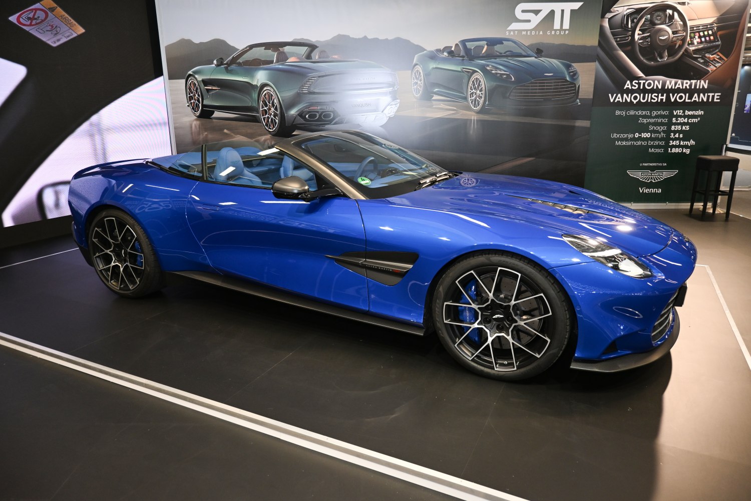 Sleek luxury convertible sports coupe with distinctive alloy wheels and aerodynamic styling