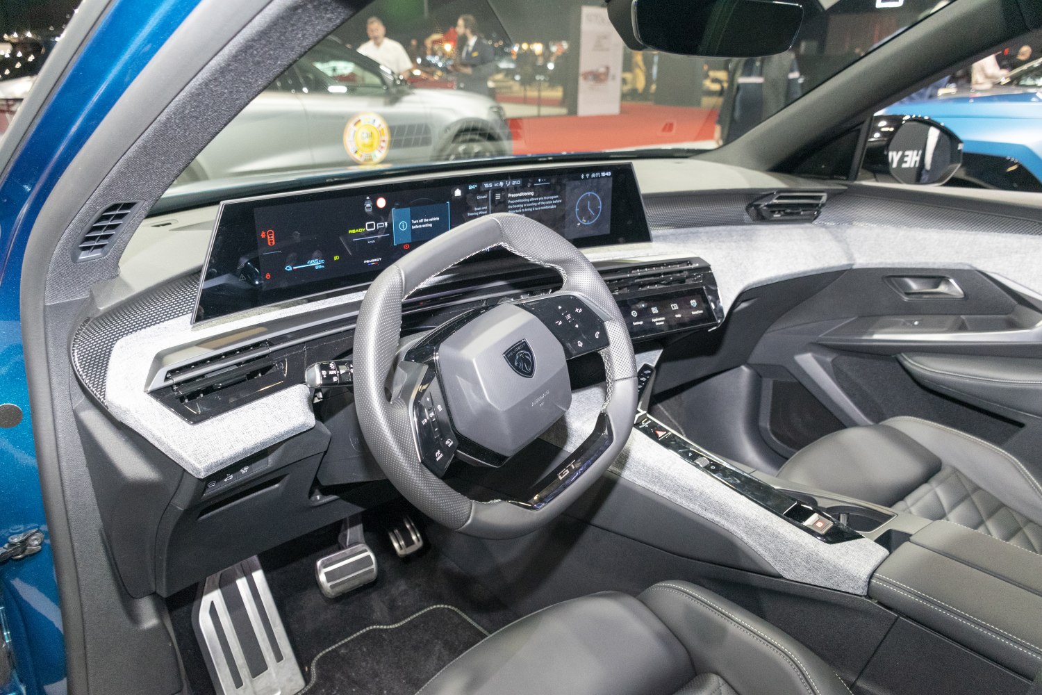 Digital instrument panel and multifunction steering wheel in modern car interior