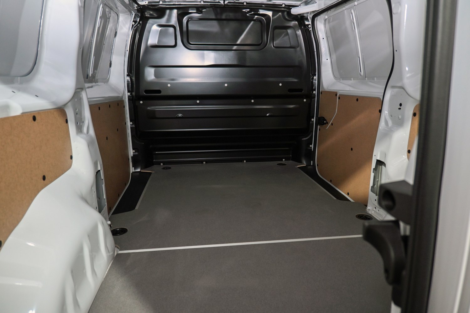 Spacious cargo interior with flat floor and reinforced side panels