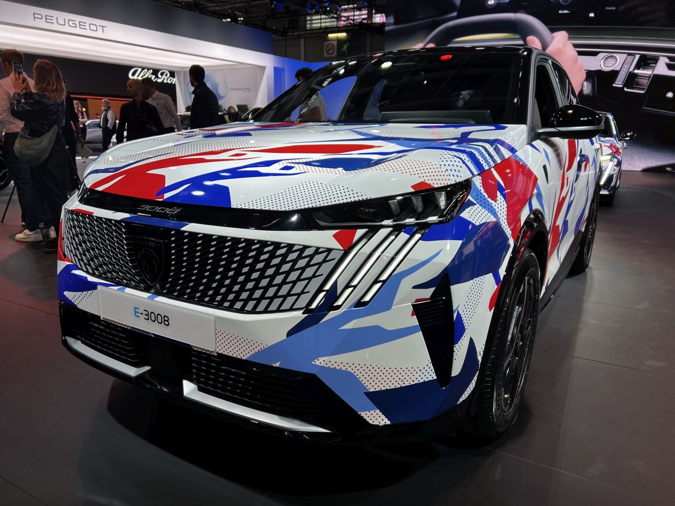 Bold front grille and distinctive LED headlights with colorful abstract wrap