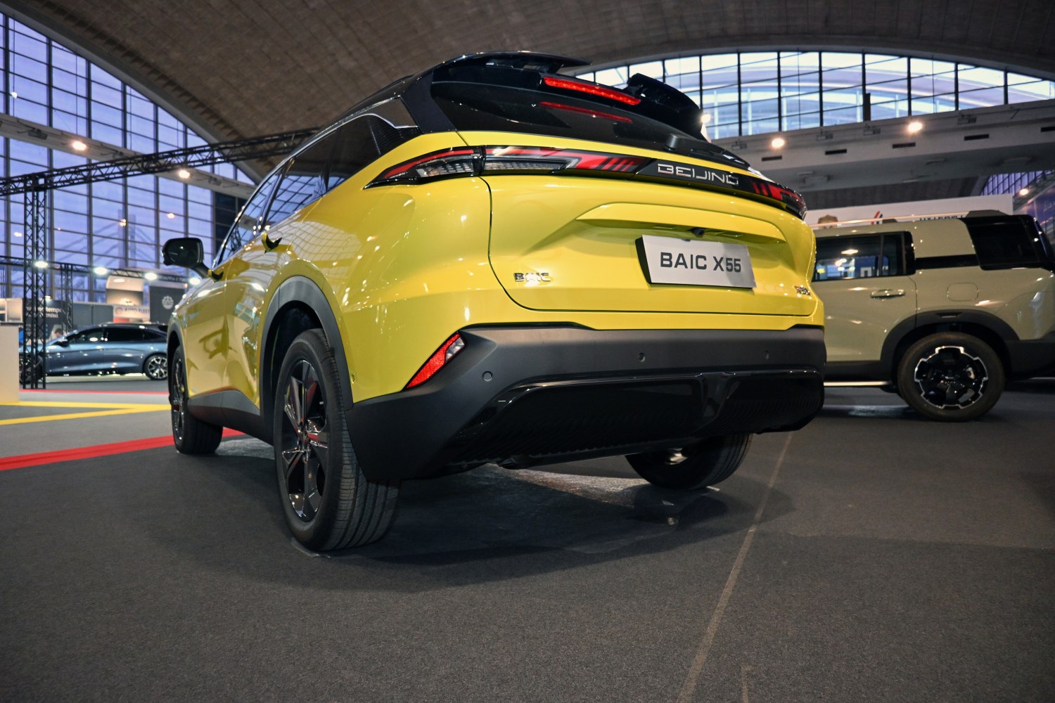 Rear view and LED tail light design of a modern yellow SUV