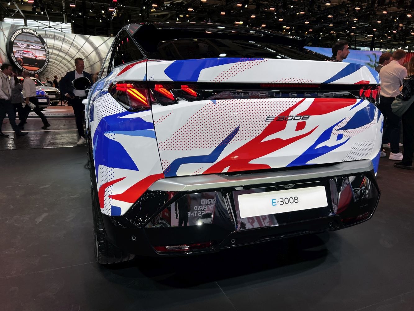 Rear view with unique taillights and graphic body wrap