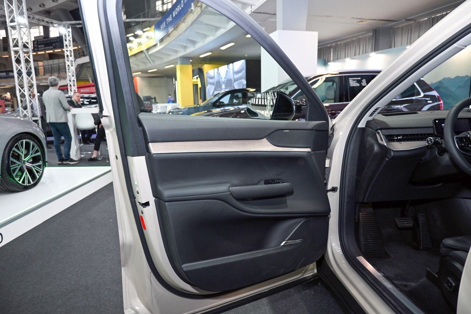 Volvo EX90 interior door panel with black leather and wood trim