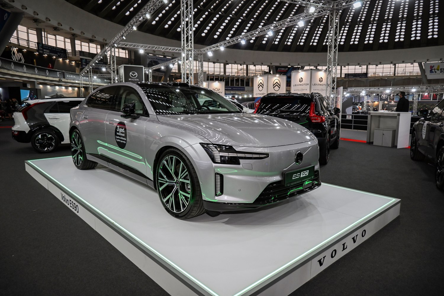 Electric luxury sedan with sleek headlights and aerodynamic body design