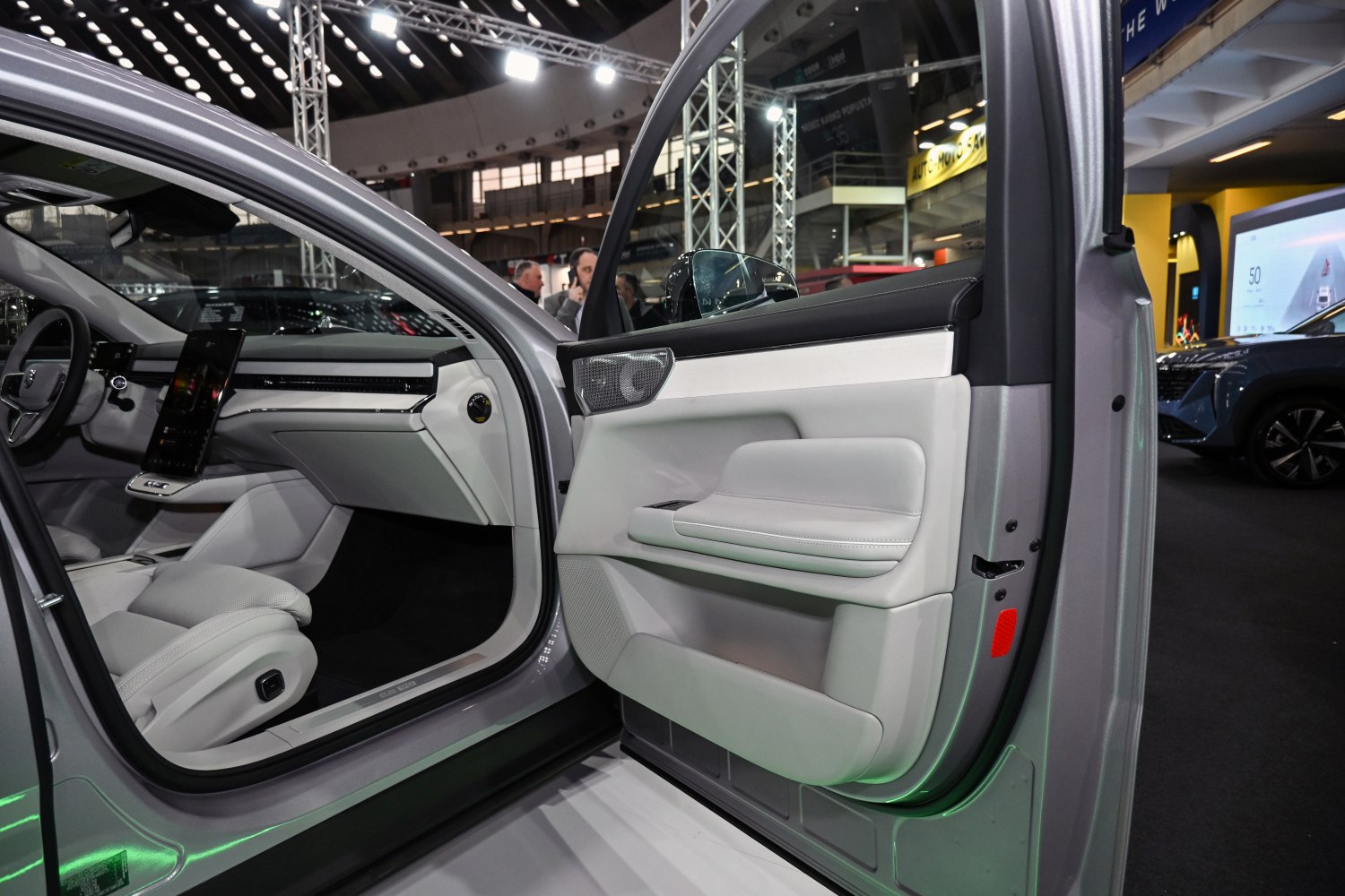 Modern car interior with digital display and white leather seats