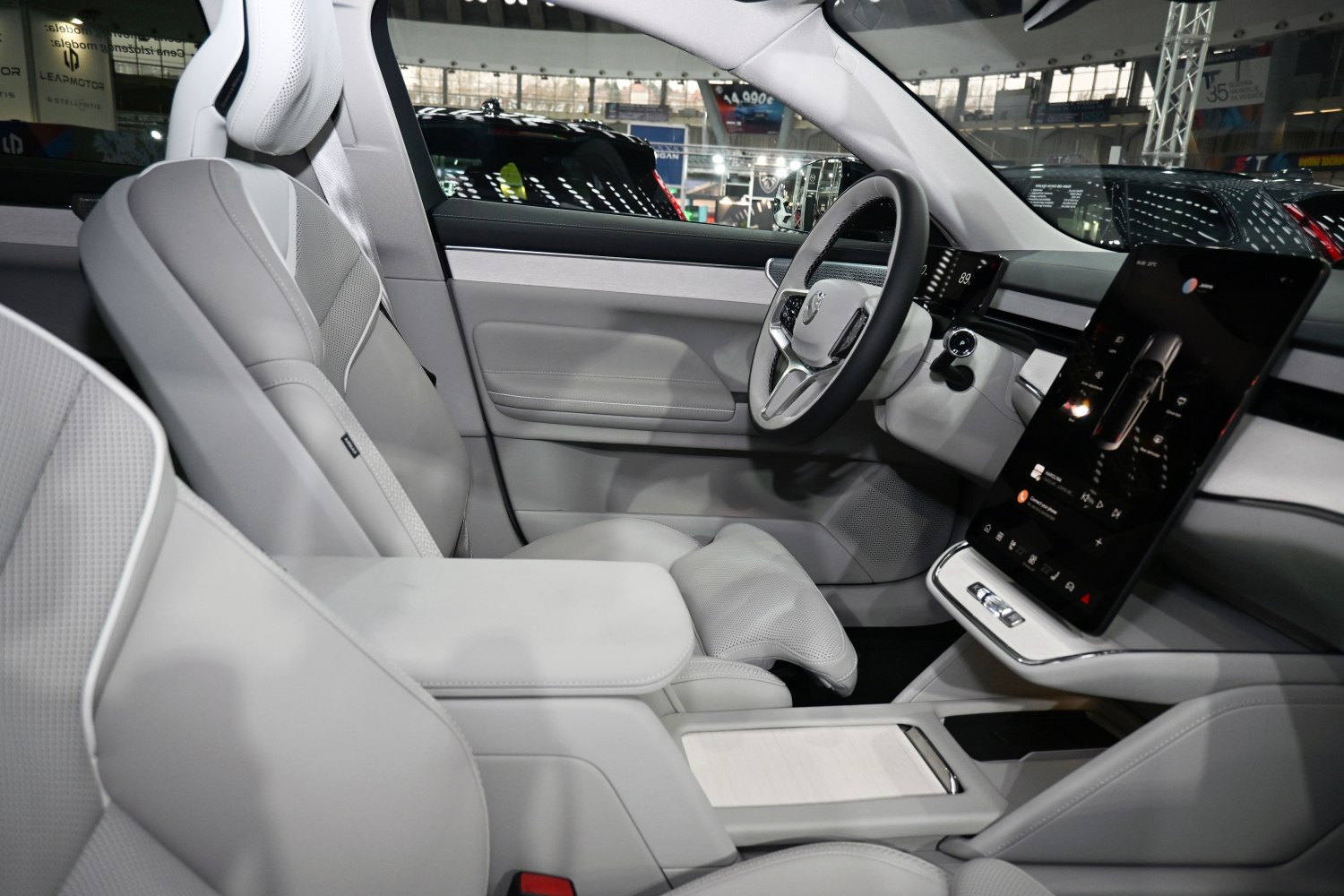 Premium light leather seats with large vertical touchscreen display