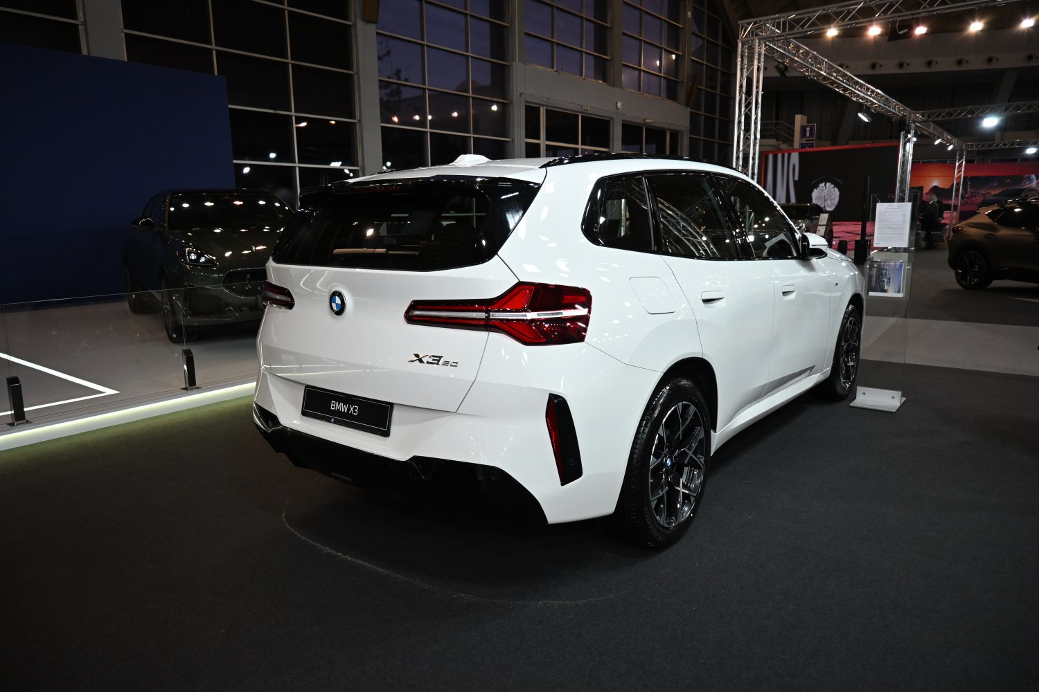 Rear view of white SUV with modern LED tail lights and aerodynamic design