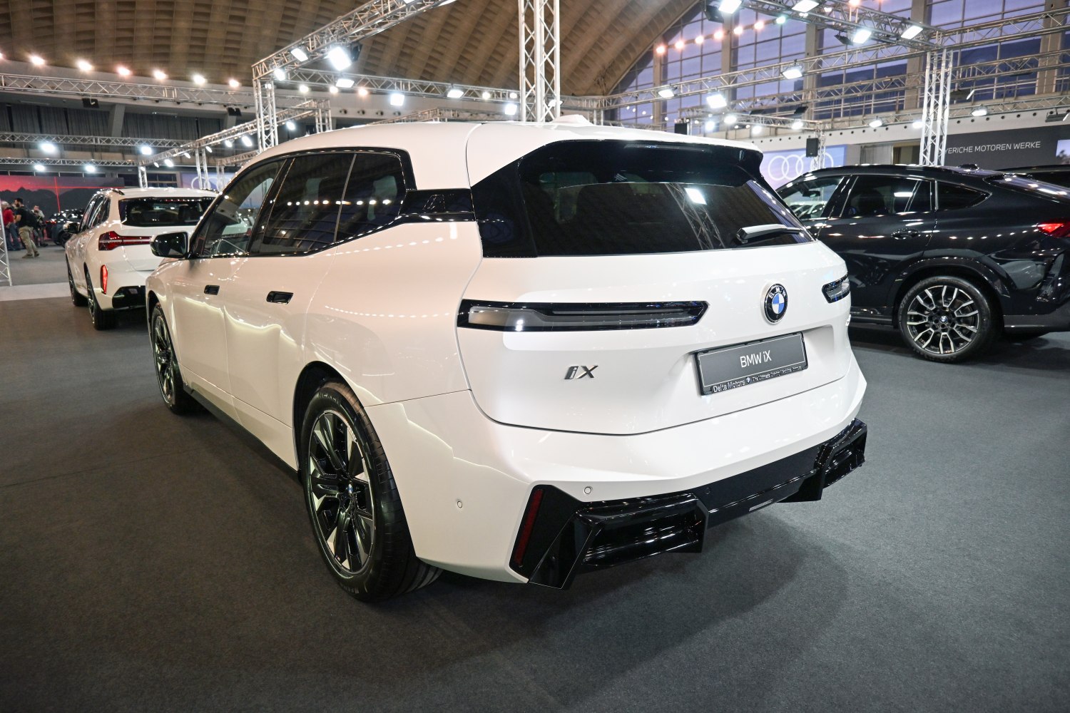 Rear view of BMW iX with updated rear lights and sleek facelift design