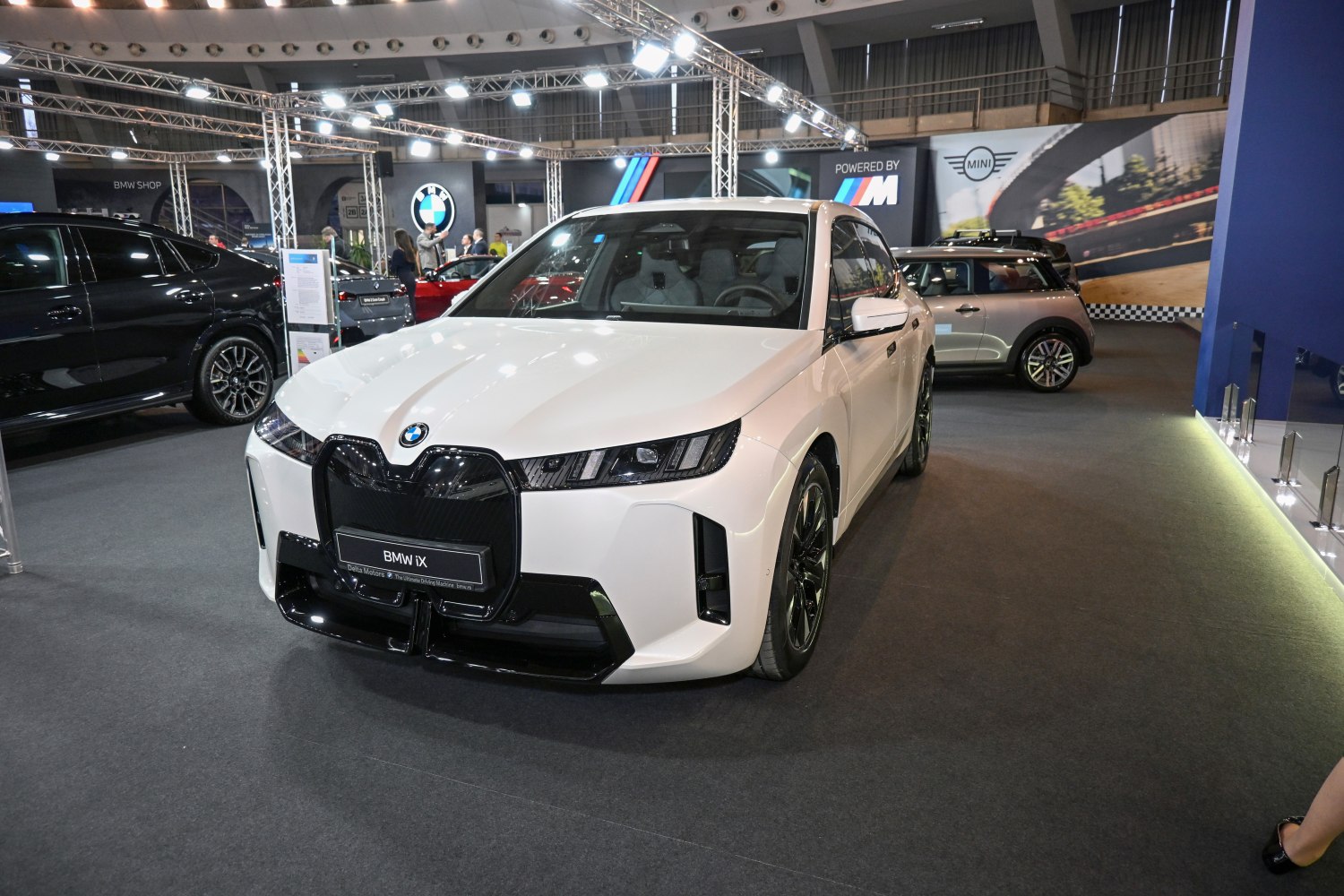Front view with sleek headlights and distinctive large grill