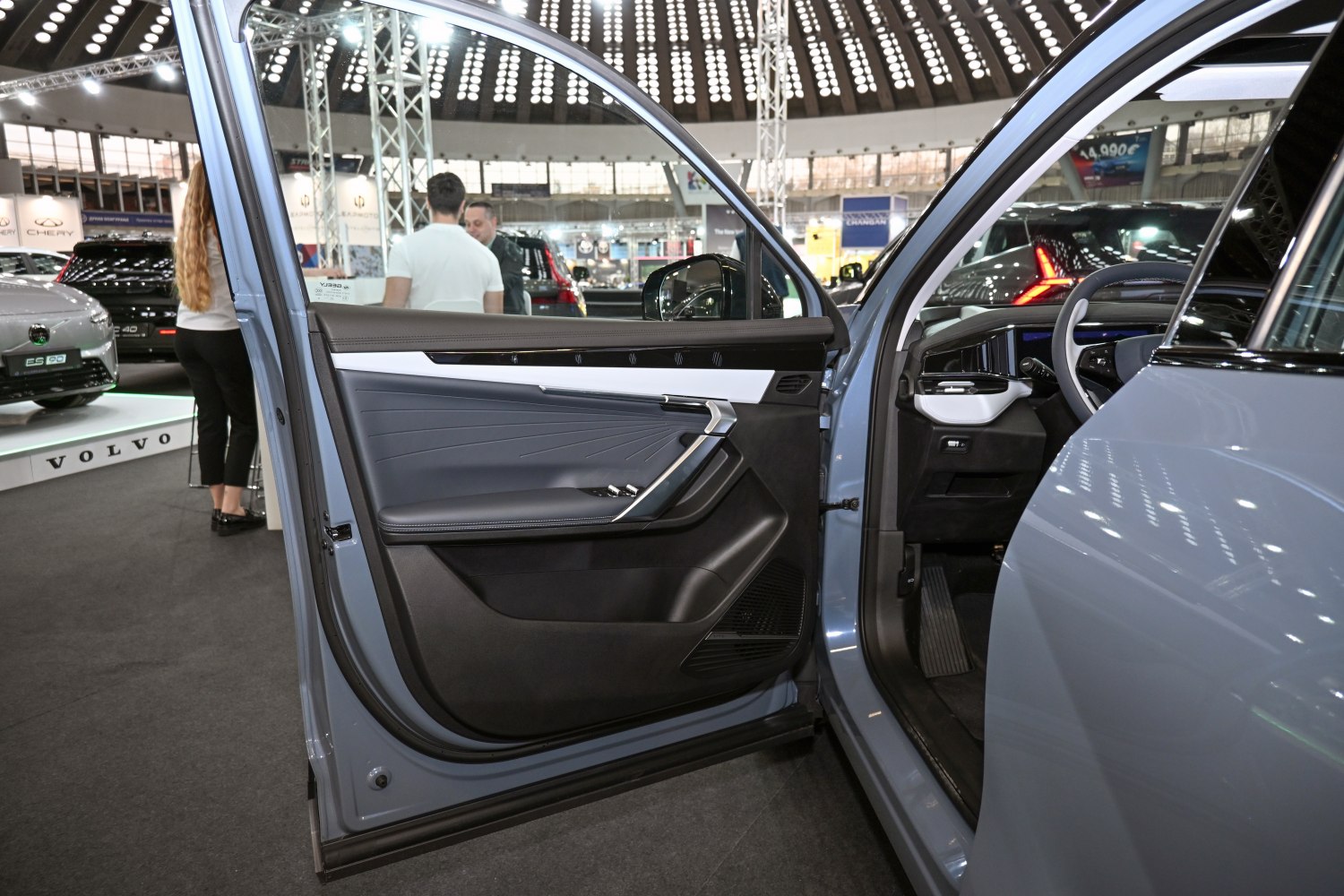 Sleek modern car door interior with detailed panel and controls