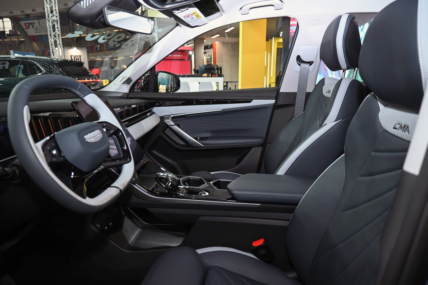 Modern steering wheel, dashboard, and comfortable front seats