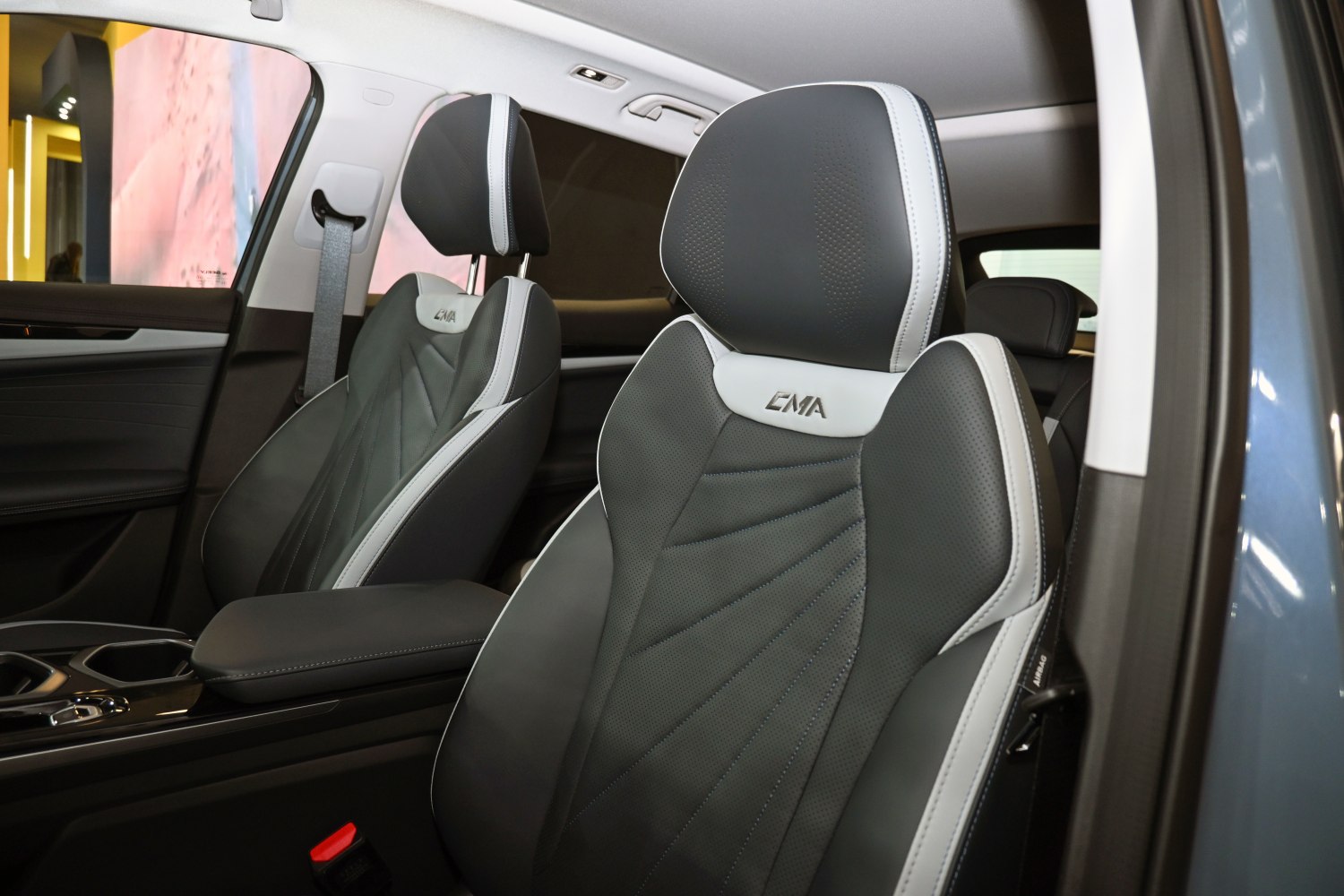 Black and white perforated seats with EMA logo and detailed stitching