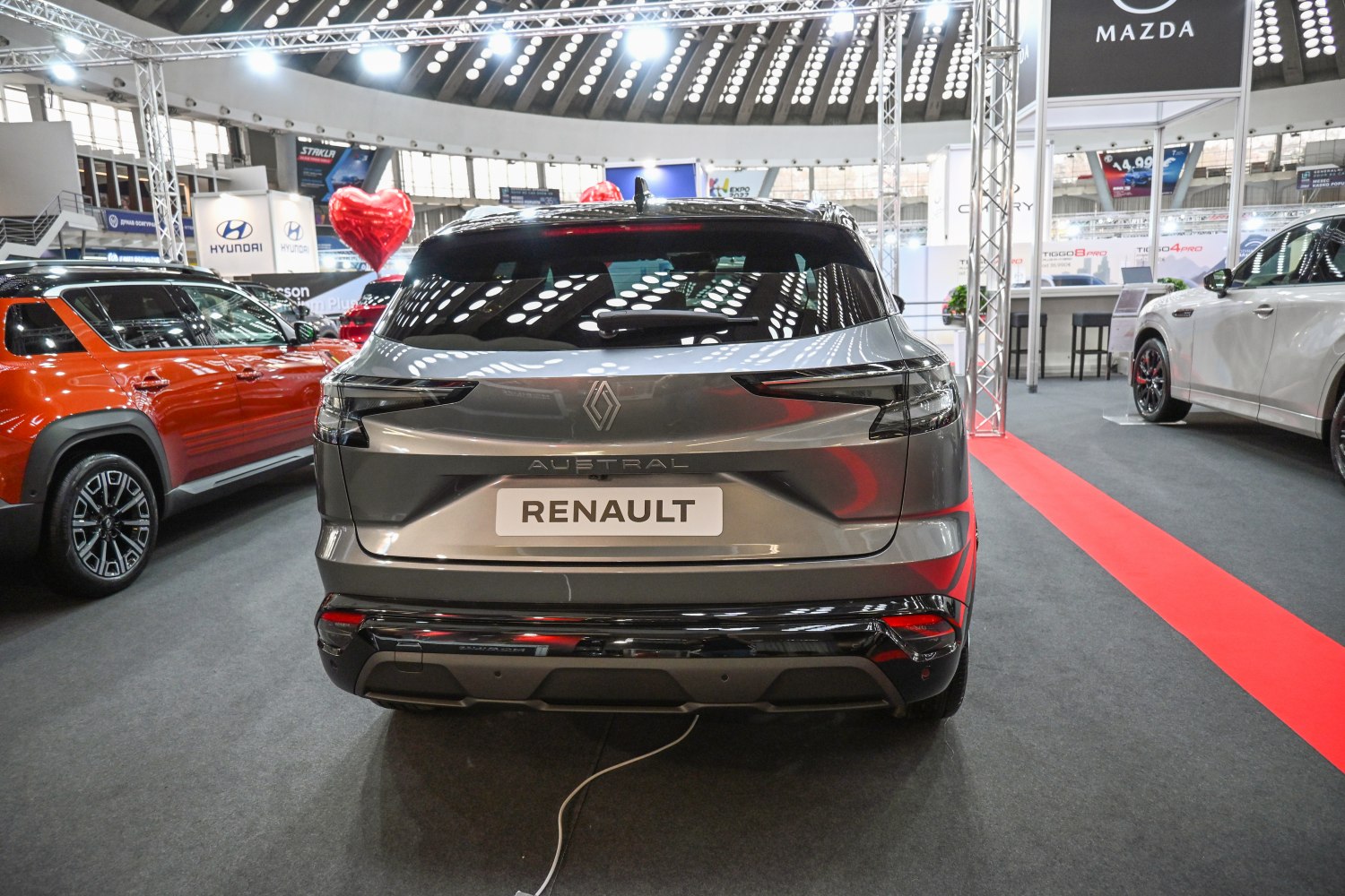 Rear view of a modern SUV with sleek taillights and blacked-out lower bumper