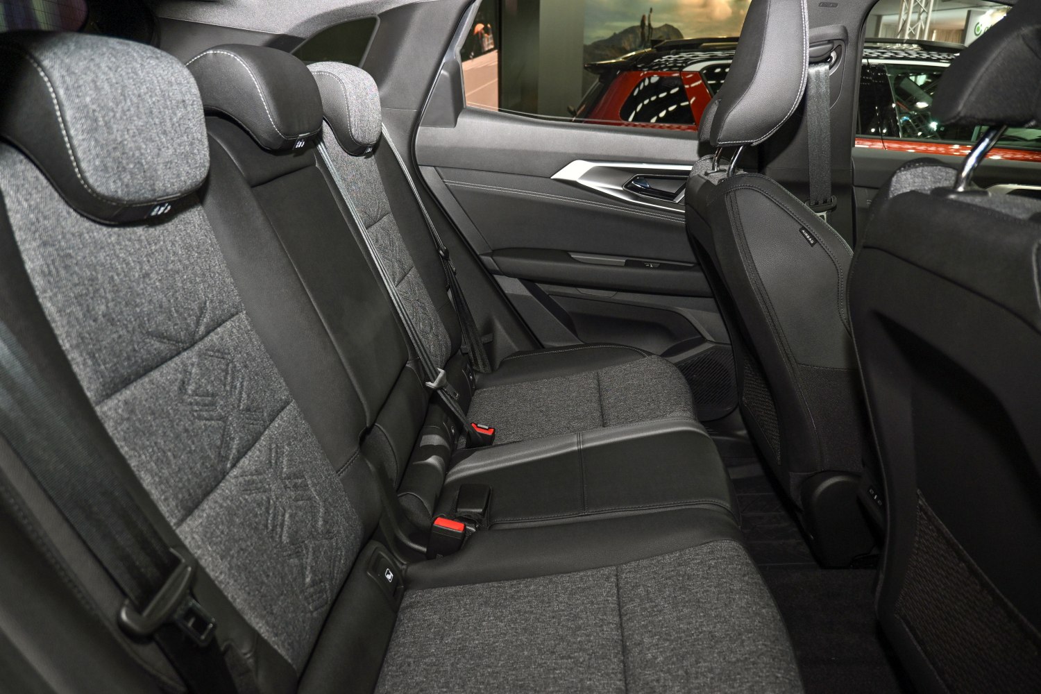 Rear seats with fabric and leather upholstery in modern car interior