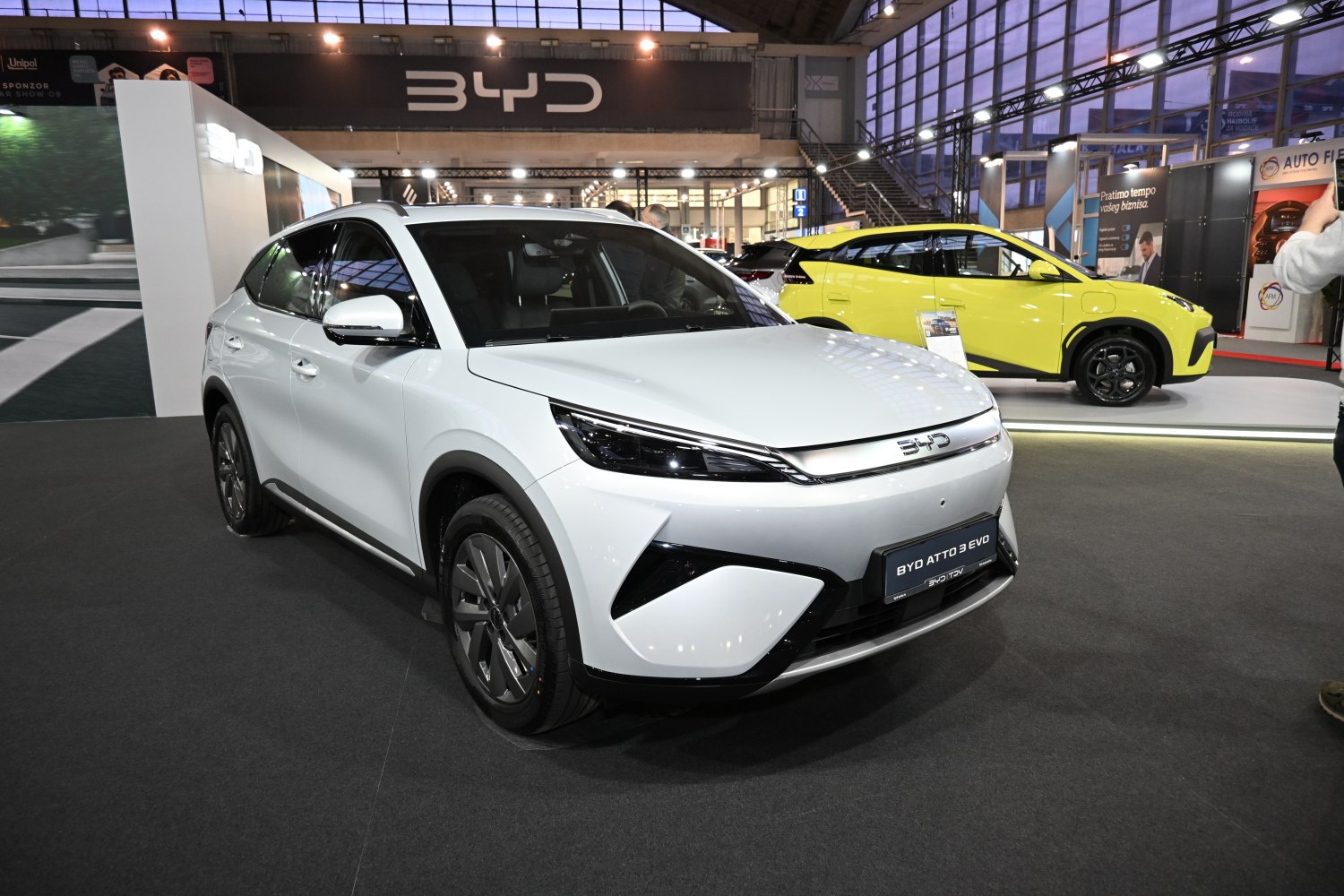 Front view of electric SUV with sleek headlights and aerodynamic design