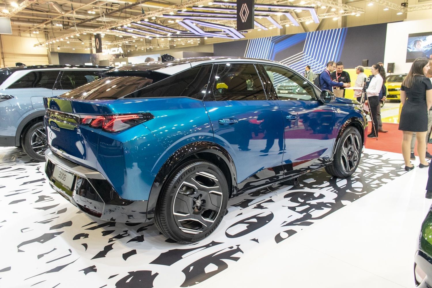 Rear profile view with distinct tail lights and alloy wheels