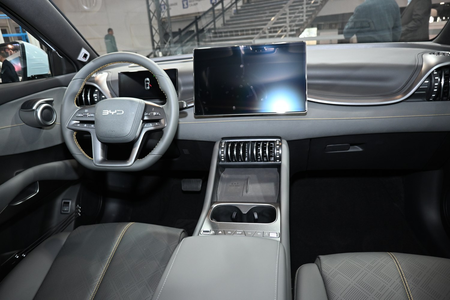 Modern dashboard and steering wheel with large digital displays and sleek center console