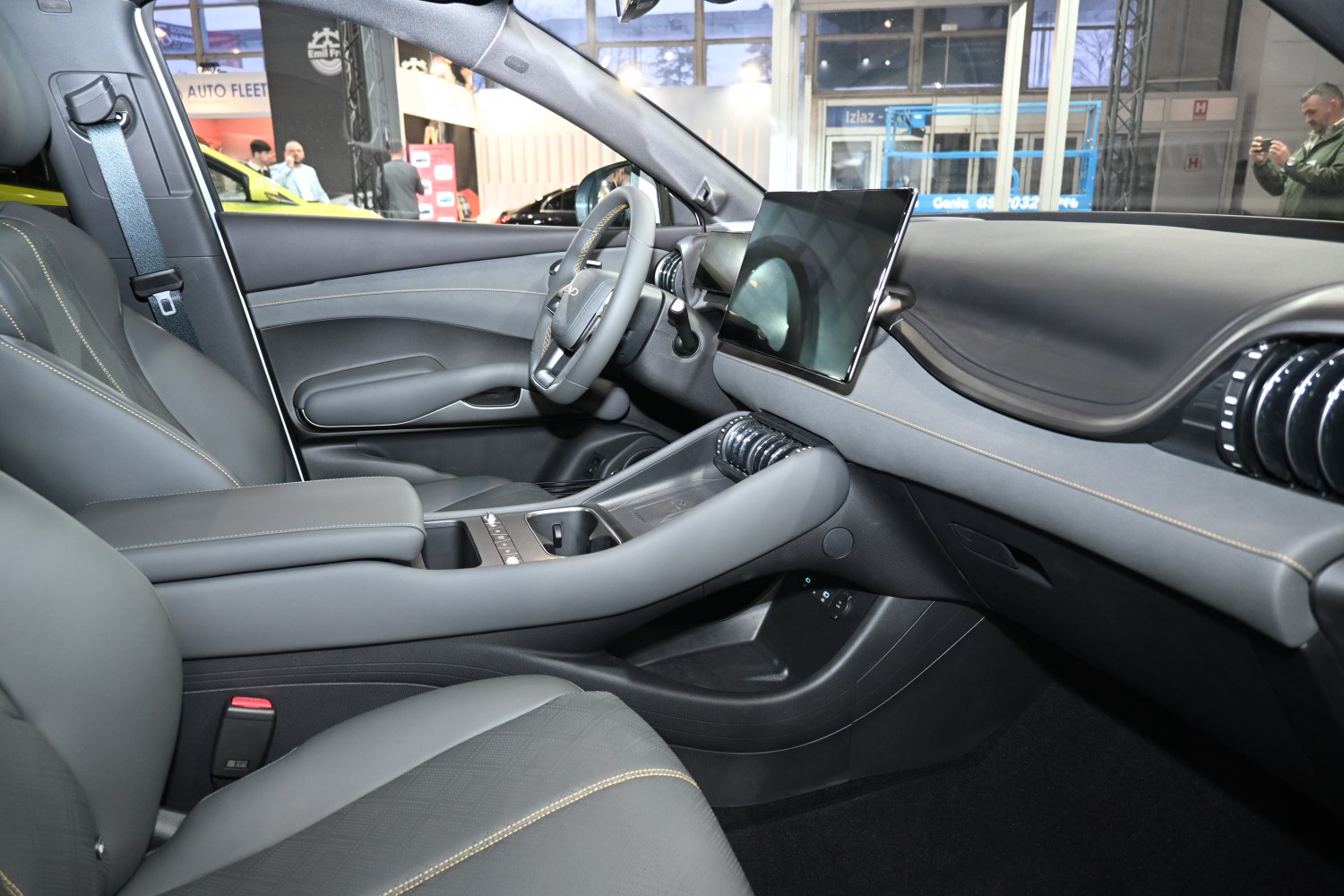 Modern dashboard with large touchscreen and luxury seats