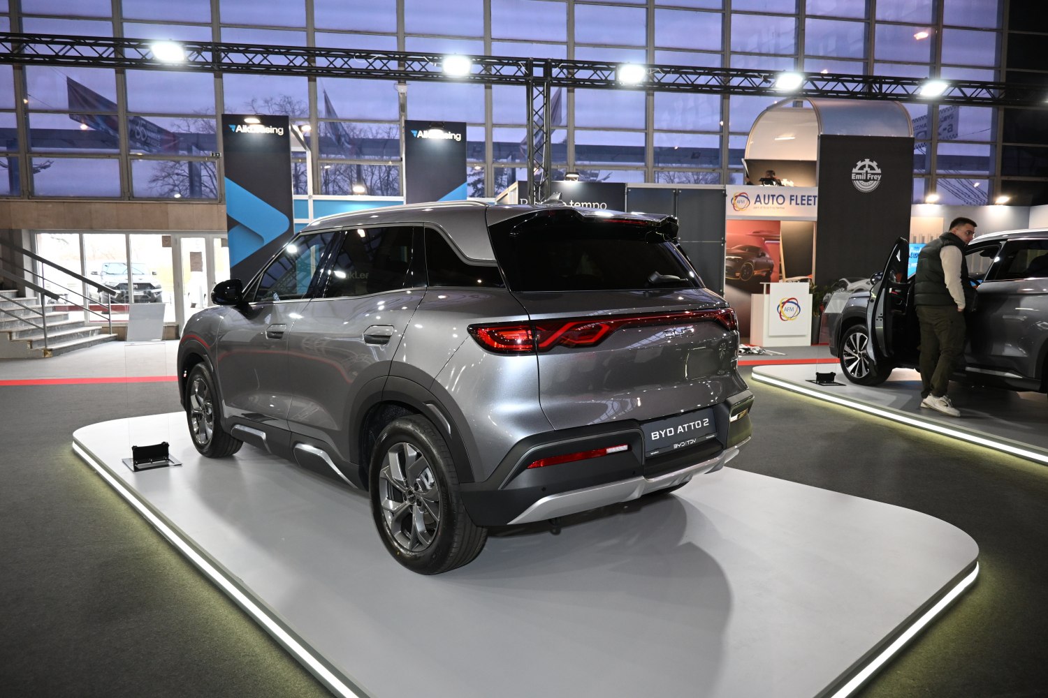 Rear view of modern compact SUV with LED taillights and roof spoiler