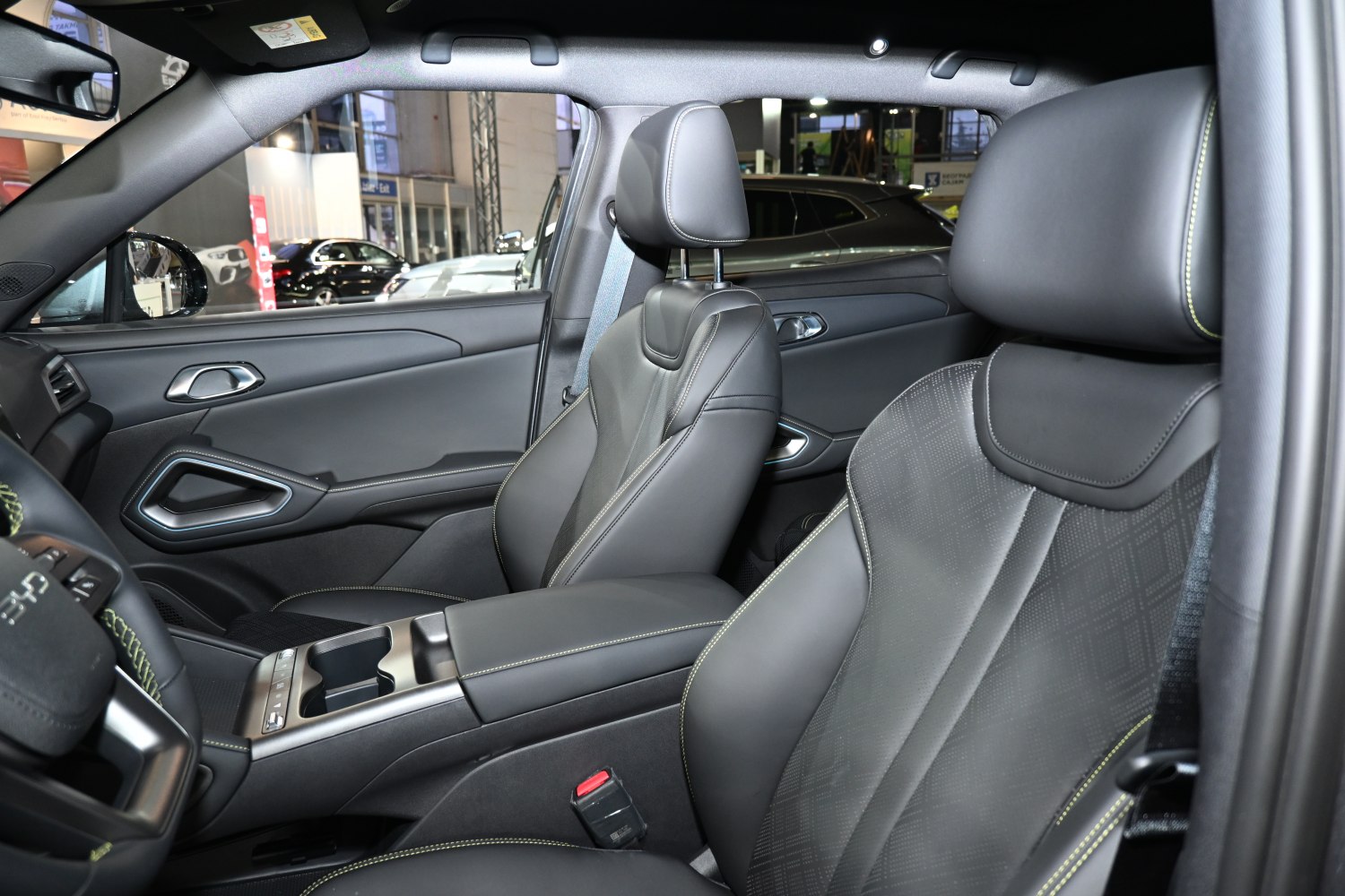 Premium leather front seats with modern door panel design