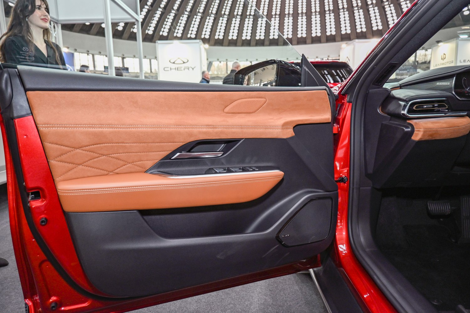 Brown leather and suede interior door panel with modern controls