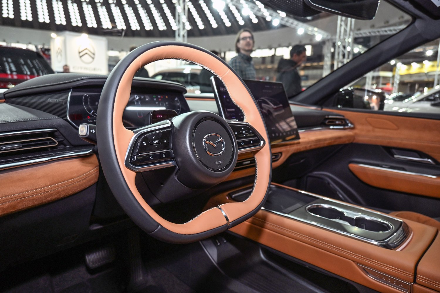 Modern steering wheel, digital dashboard, premium brown leather interior