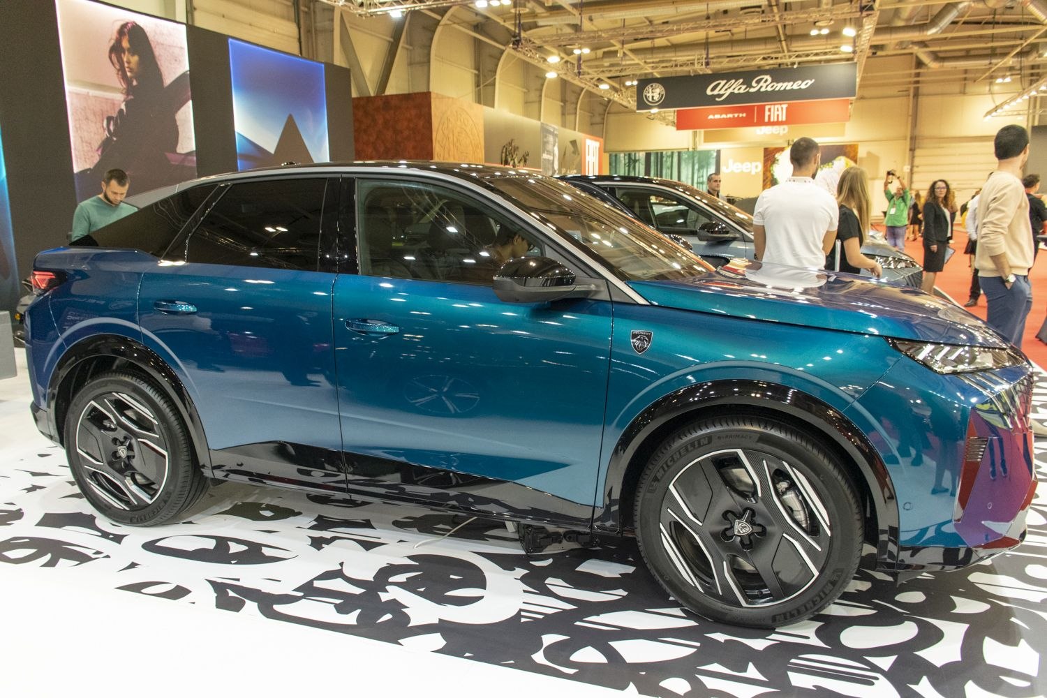 Blue compact SUV with alloy wheels and sharp modern design