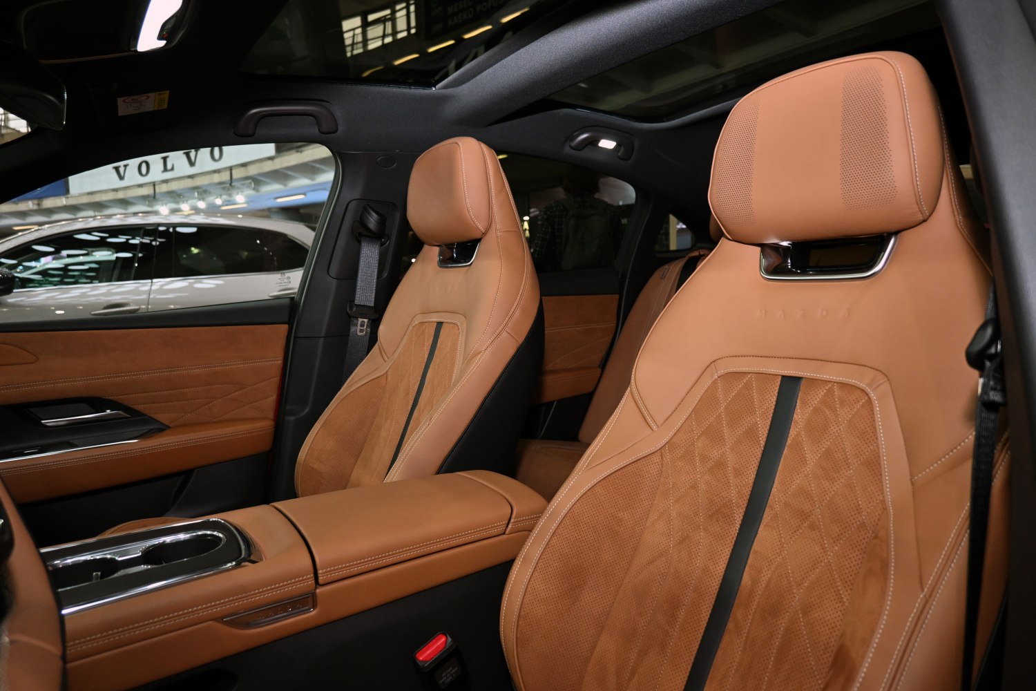Tan leather sports seats with panoramic roof