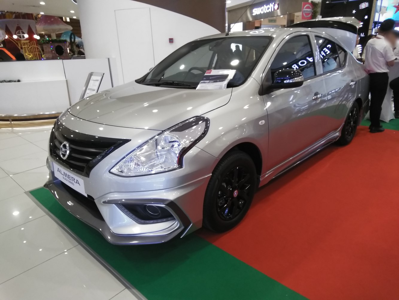 Front-side view with black wheels and sleek body design