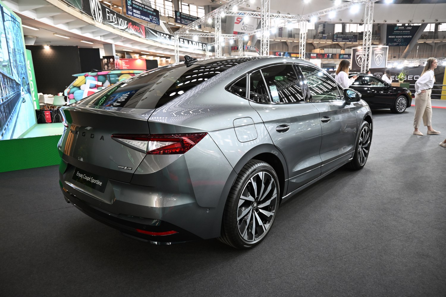 Rear and side view of a sleek modern Sportline coupe with alloy wheels