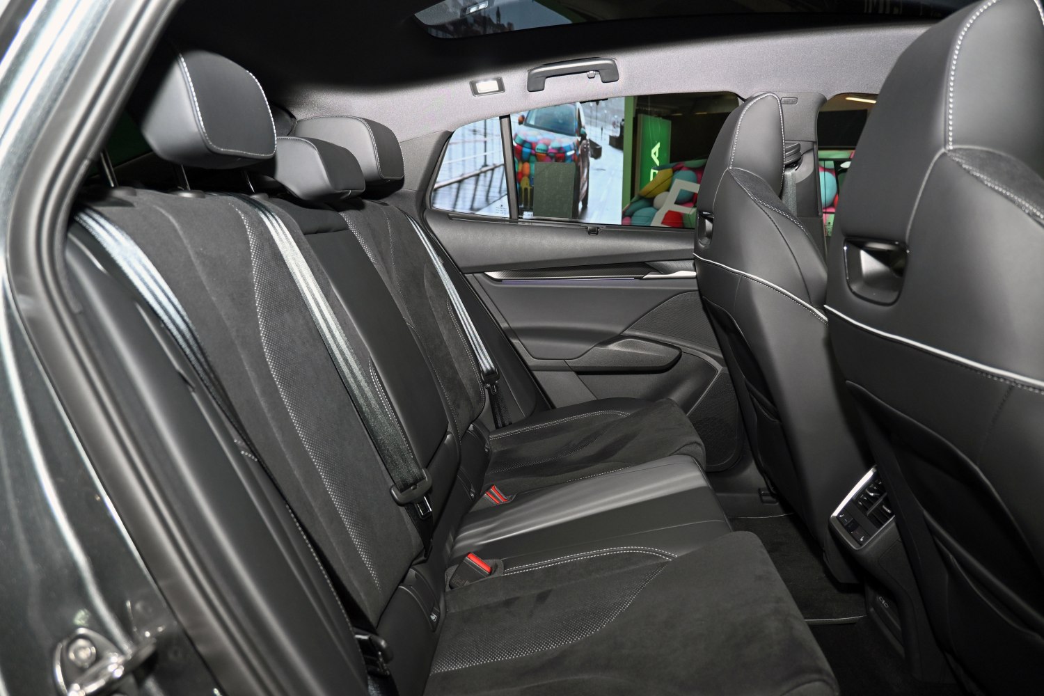 Spacious rear seat interior with premium materials and modern design.