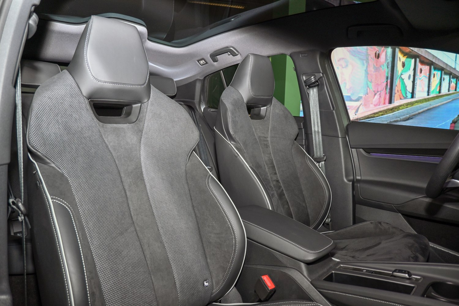 Sport seats with leather and suede upholstery in modern coupe interior