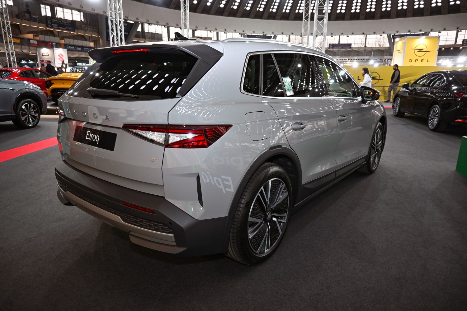 Rear and side profile of a modern SUV with distinctive tail lights and intricate wheel design.