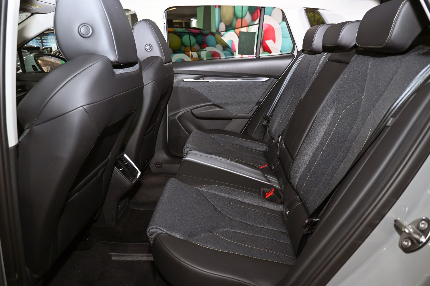 Rear seats with fabric and leather upholstery, rear air vents, modern door panel