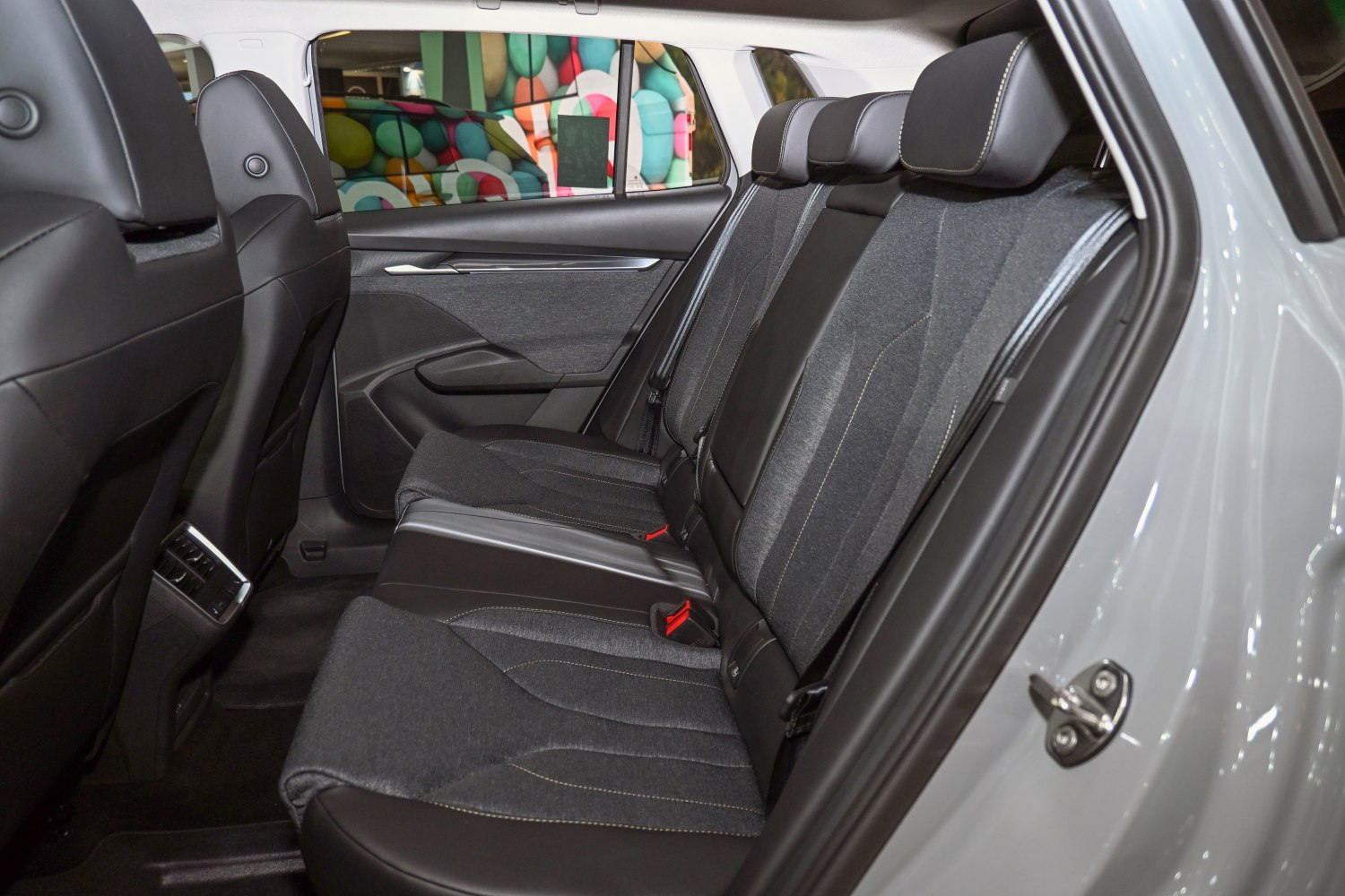 Spacious rear seat interior with cloth and leather upholstery.