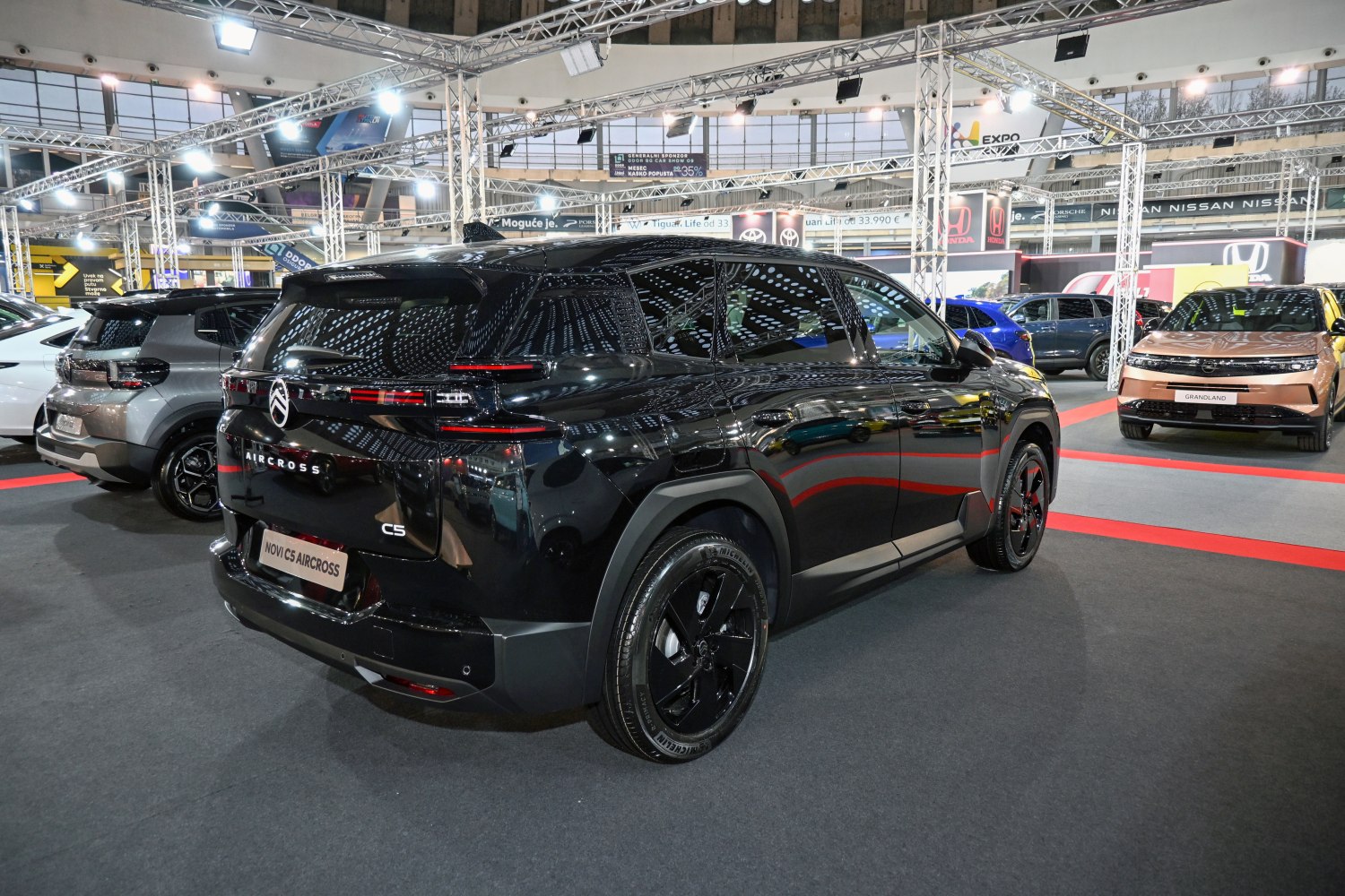Sleek rear view and black alloy wheels of a modern SUV