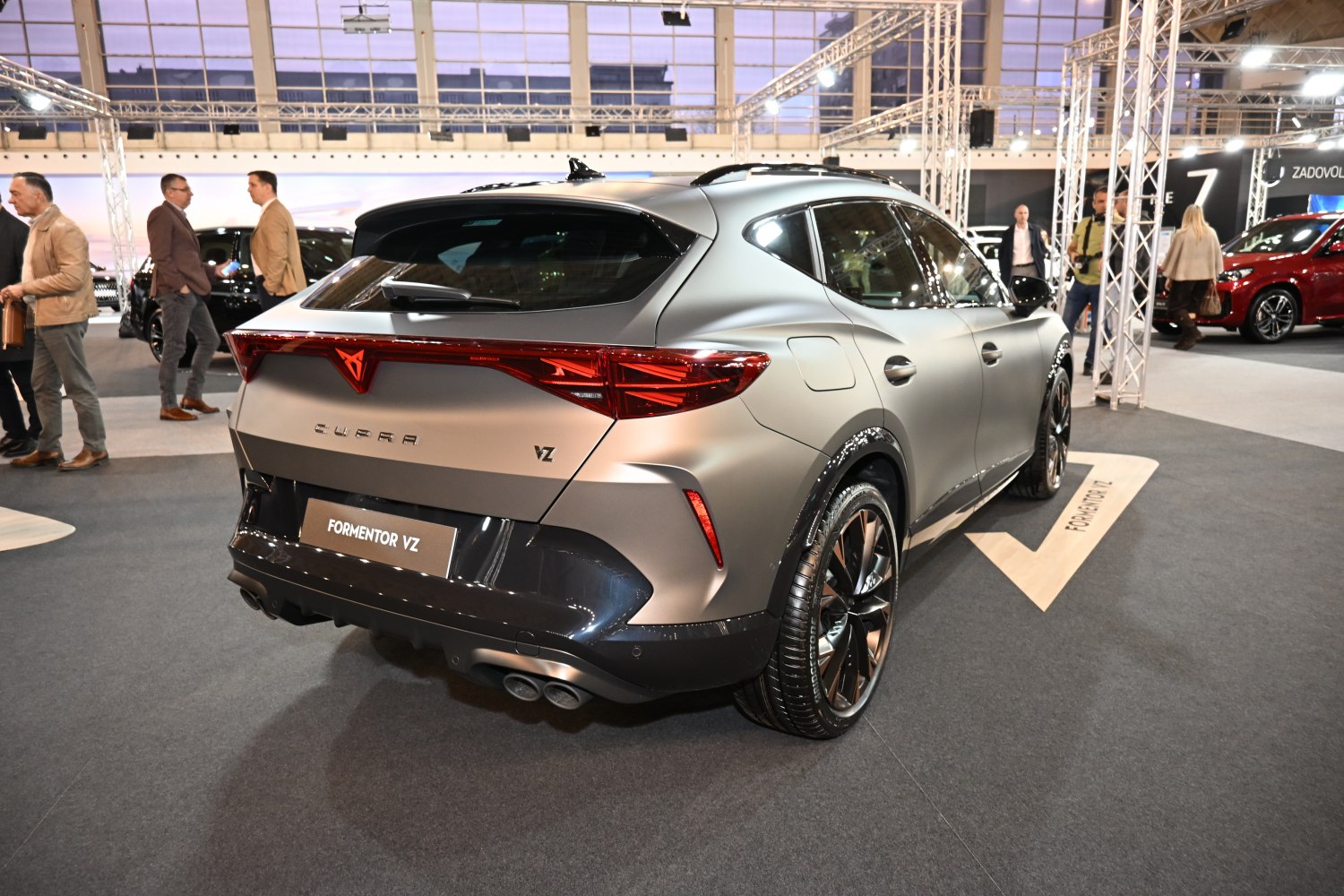 Sporty SUV rear with connected tail lights and dual exhausts
