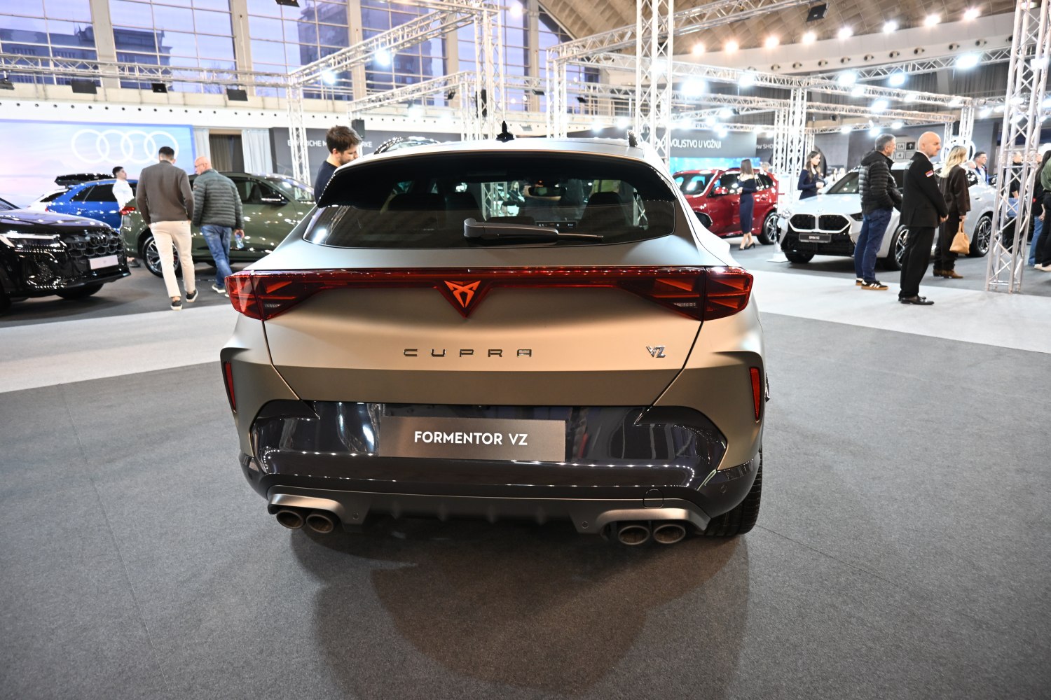 Rear view of SUV with quad exhaust and full-width light bar