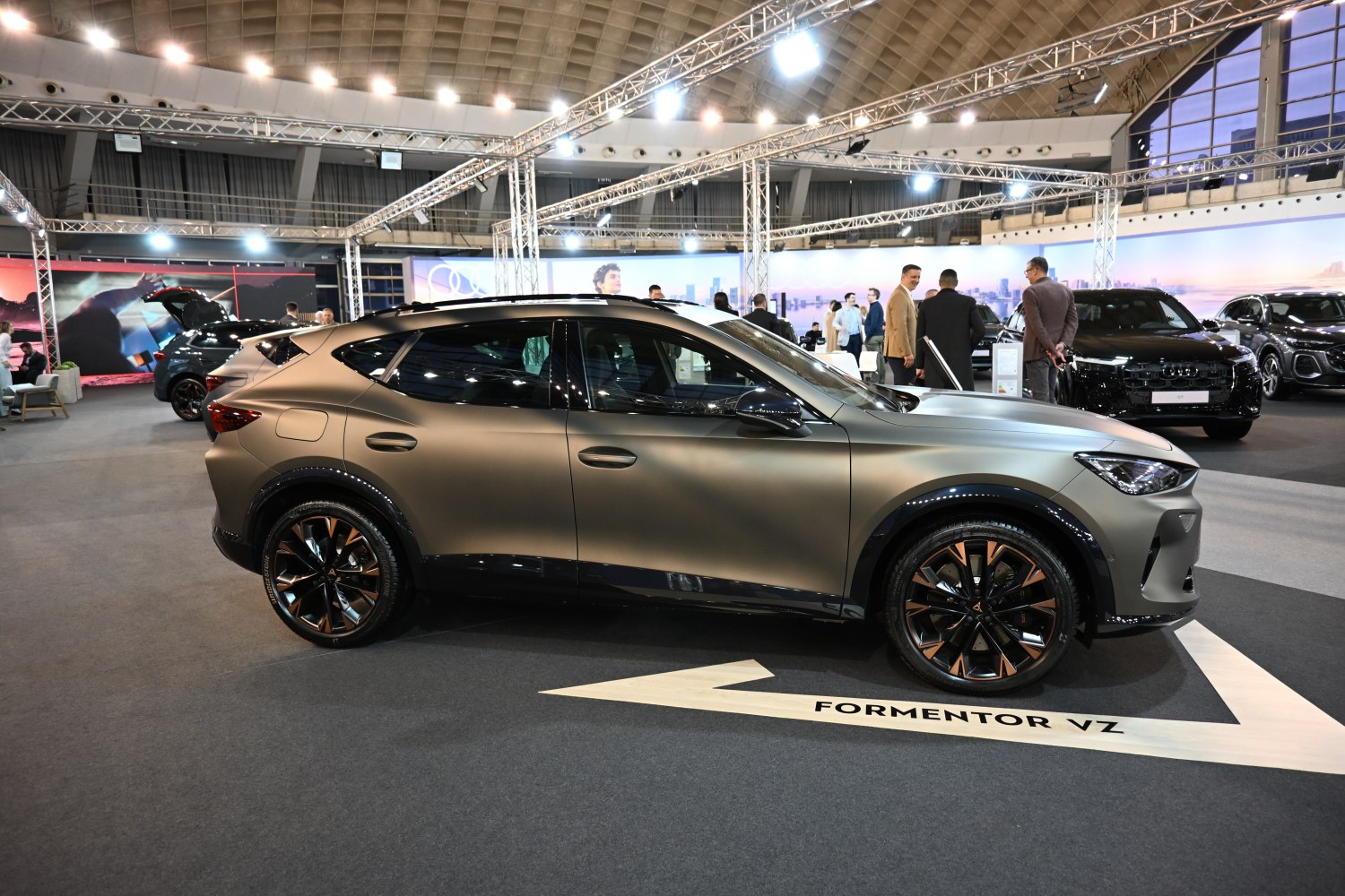 Matte gray SUV with distinct black and copper alloy wheels side profile.