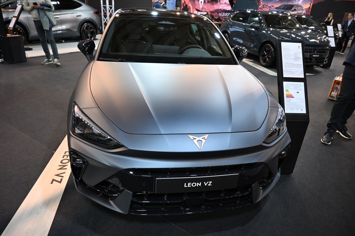 Aggressive headlights and sculpted hood of a sporty hatchback