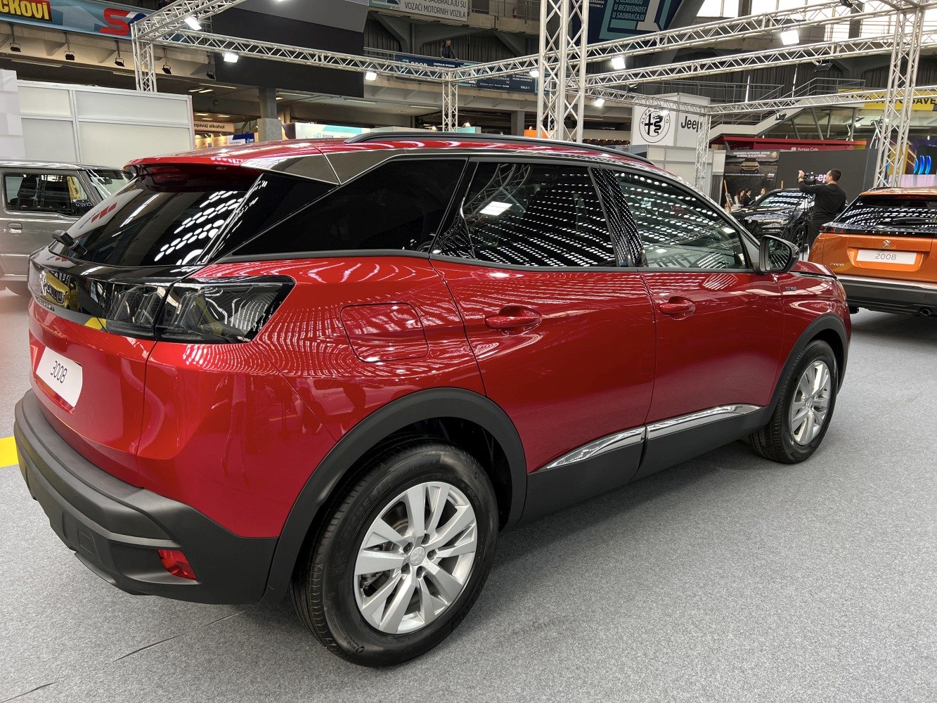 Rear side view with sleek tail lights and alloy wheels