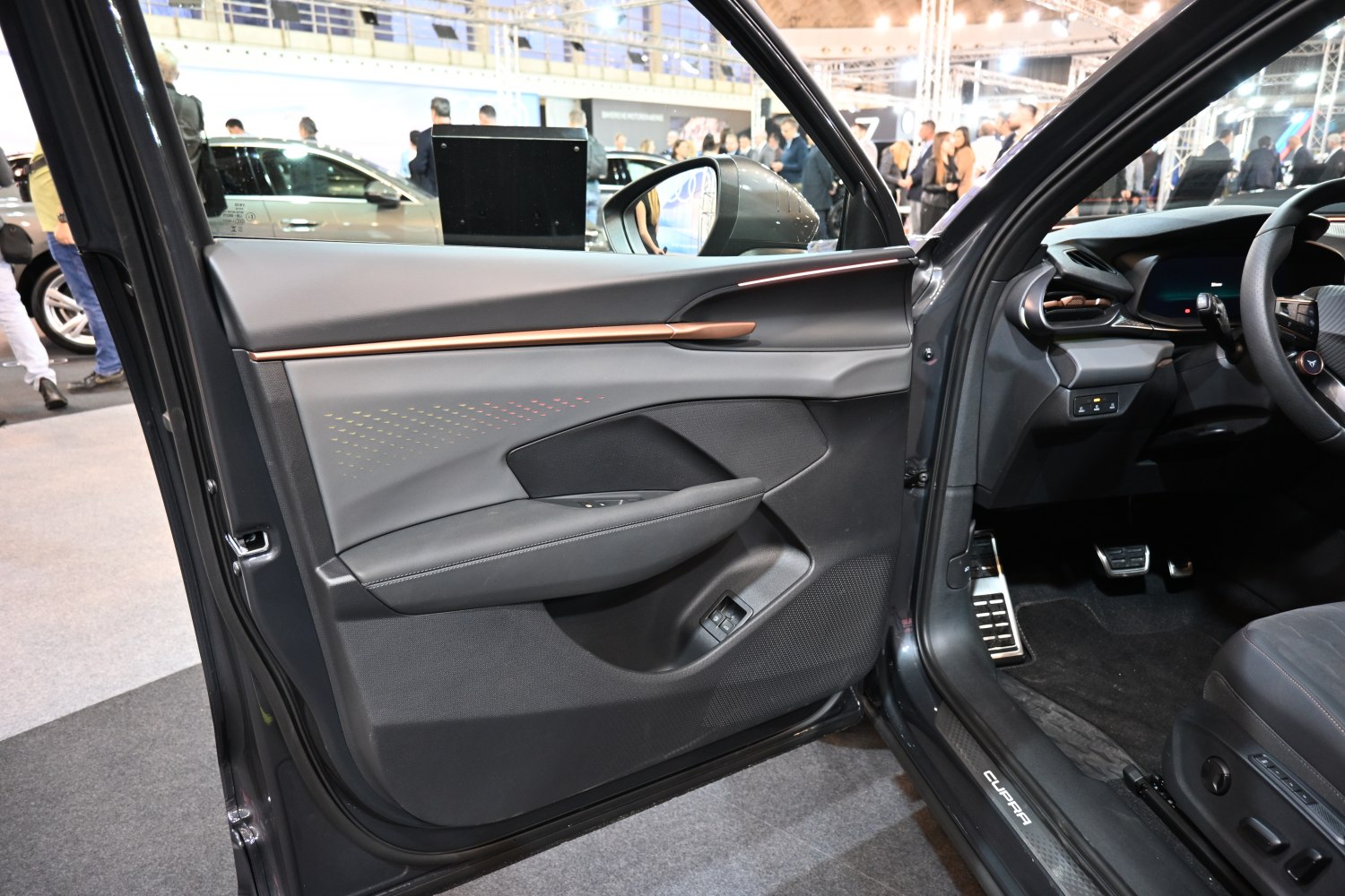 Interior door panel with ambient lighting and modern dashboard layout